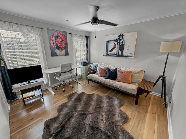 living room featuring ceiling fan and wood-type flooring