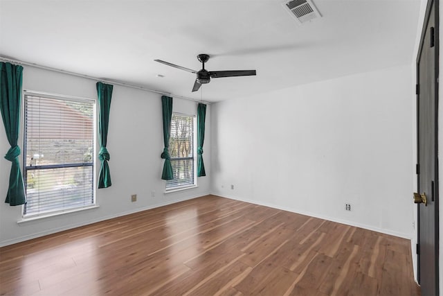 unfurnished room with ceiling fan and hardwood / wood-style floors