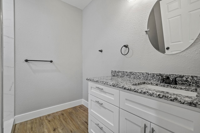 bathroom featuring hardwood / wood-style floors and vanity