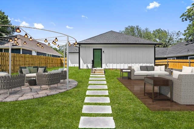 view of yard with entry steps, a patio area, outdoor lounge area, and fence