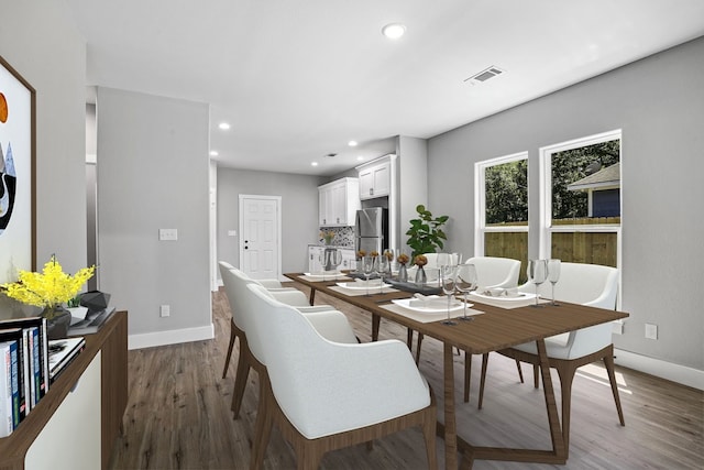 dining space featuring hardwood / wood-style flooring