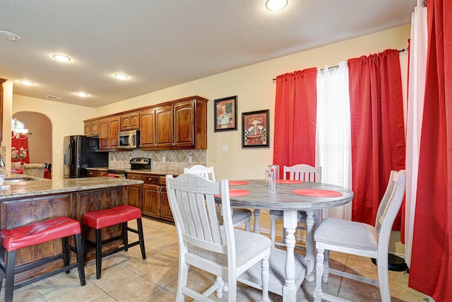 tiled dining area with sink