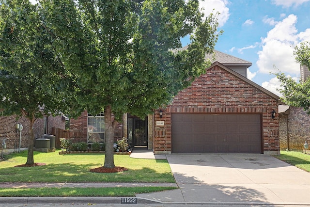 view of front of house with a garage and a front yard