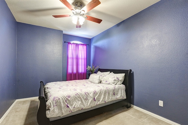 bedroom with ceiling fan and carpet