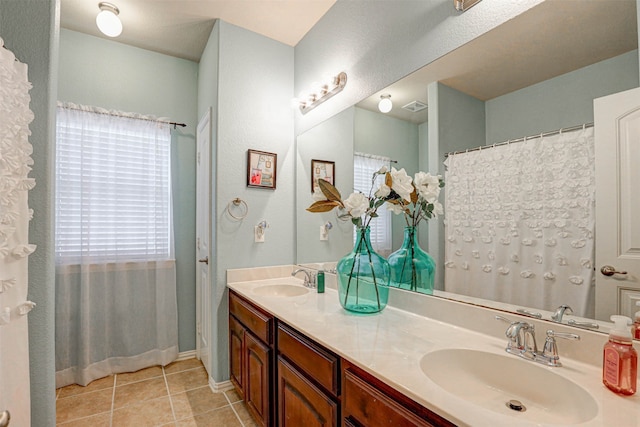 bathroom with tile patterned flooring and vanity