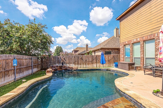 view of swimming pool featuring a patio area