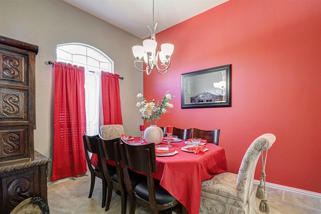 carpeted dining space featuring vaulted ceiling and a notable chandelier