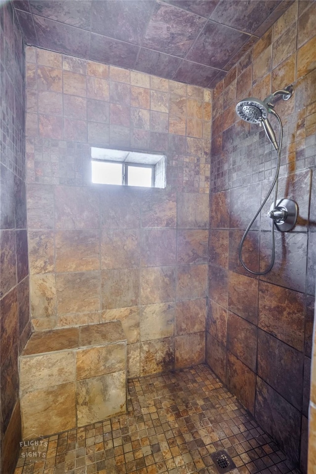 bathroom featuring tiled shower