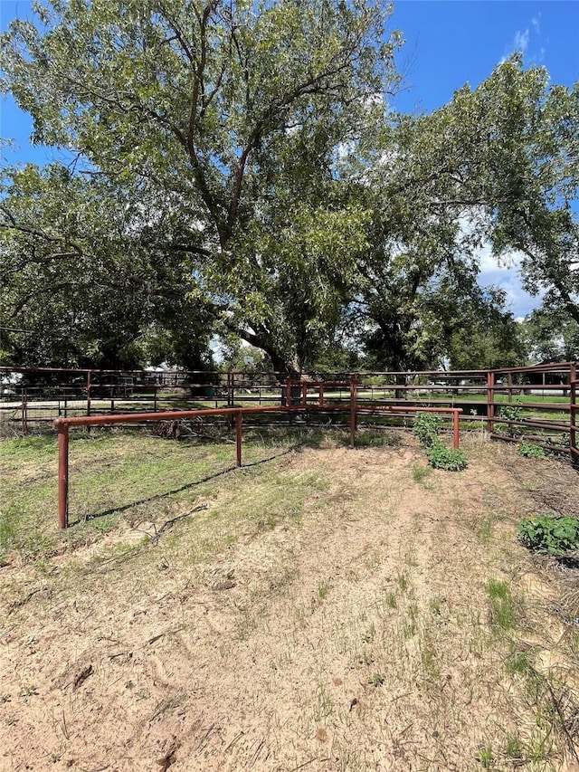 view of yard with a rural view