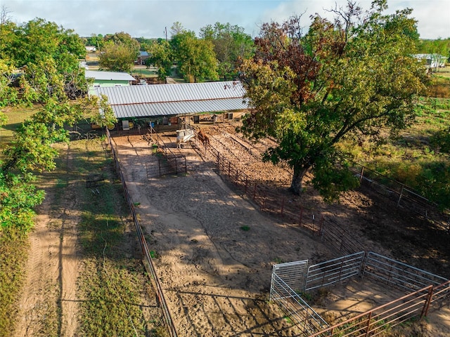 view of yard featuring an outbuilding and a rural view