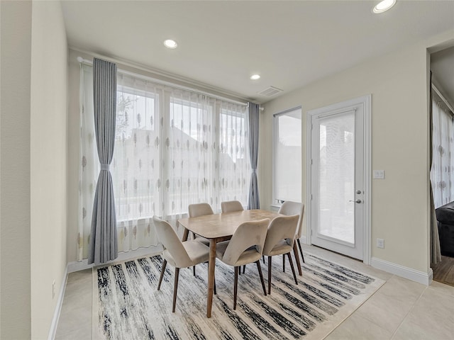 dining space with light tile patterned floors, baseboards, visible vents, and recessed lighting