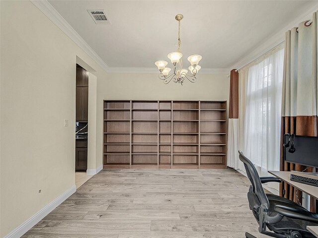 home office with light wood-type flooring, an inviting chandelier, and ornamental molding