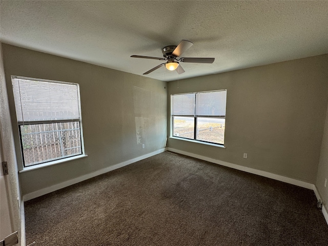 carpeted empty room featuring a textured ceiling and ceiling fan