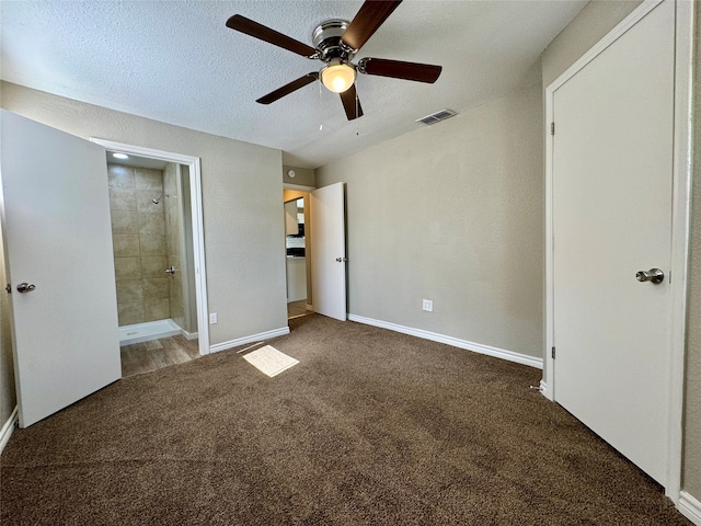 unfurnished bedroom featuring carpet, ensuite bath, and ceiling fan