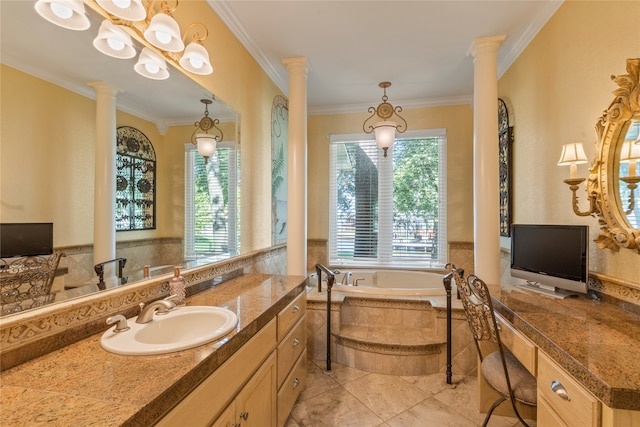 bathroom featuring a relaxing tiled tub, tile patterned floors, vanity, and a healthy amount of sunlight