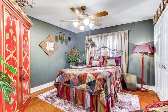 bedroom featuring ceiling fan and hardwood / wood-style floors