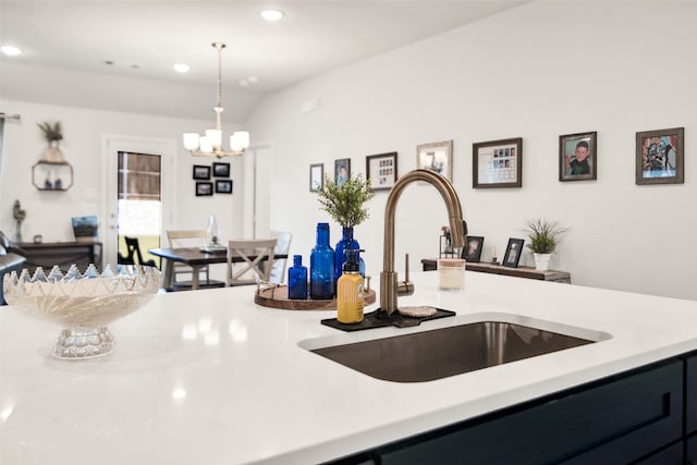 kitchen with sink, hanging light fixtures, and an inviting chandelier