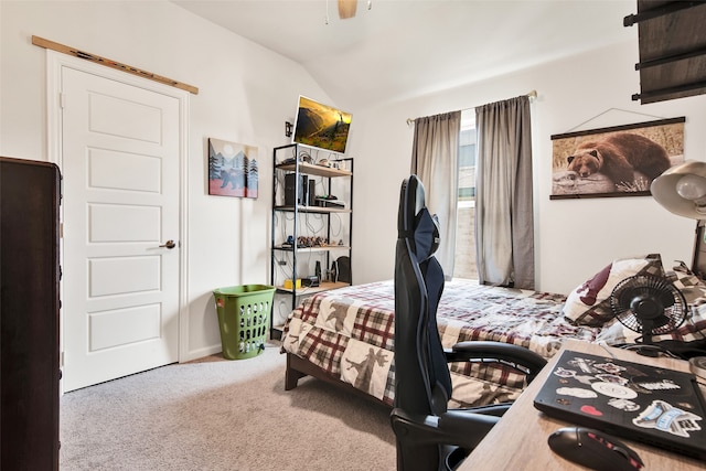 carpeted bedroom featuring vaulted ceiling