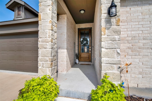 property entrance with a garage