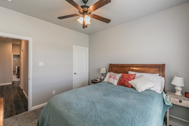 bedroom featuring dark hardwood / wood-style floors and ceiling fan