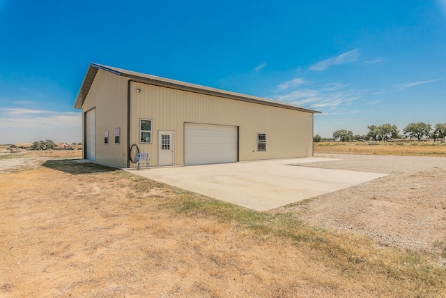 exterior space featuring an outbuilding and a garage