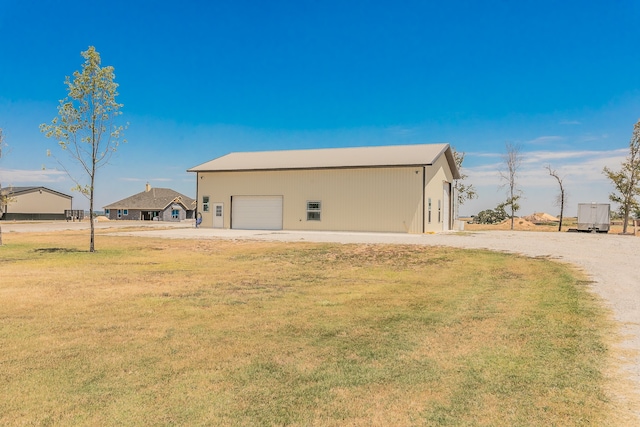 garage with a lawn