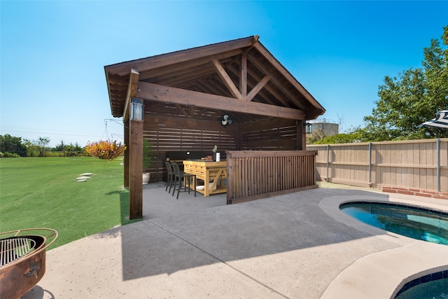 view of patio with a gazebo and a fenced in pool