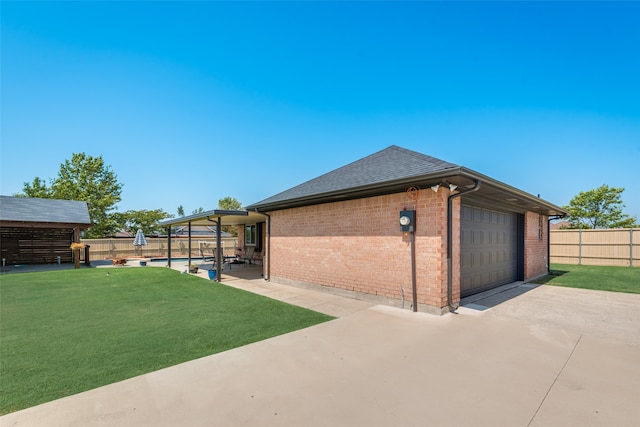 exterior space with a swimming pool and a lawn