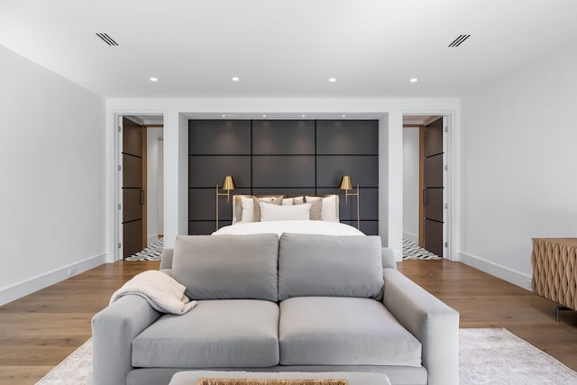 bedroom with hardwood / wood-style flooring