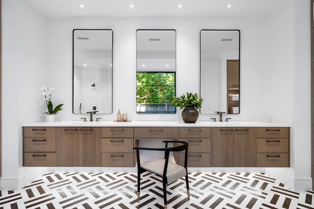 bathroom featuring a shower and vanity