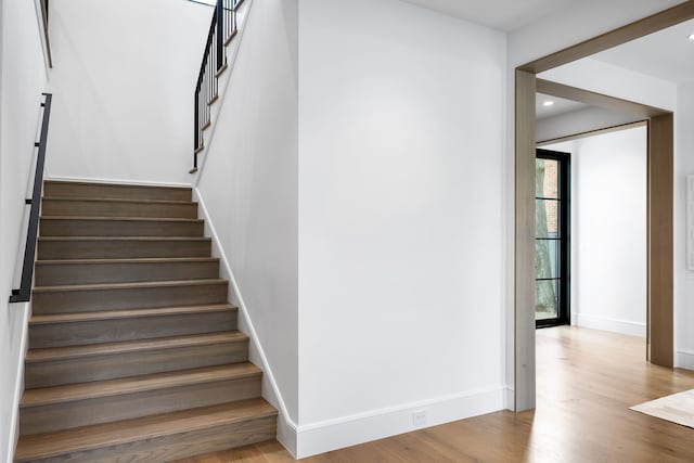 stairway with wood-type flooring