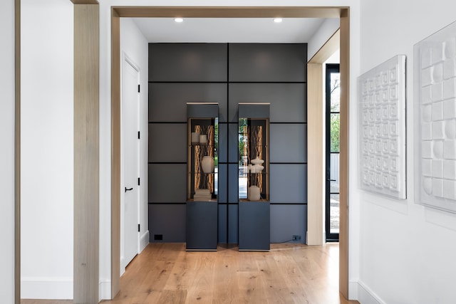 hallway with light wood-type flooring