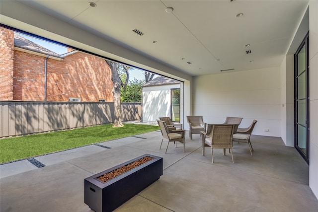 view of patio / terrace featuring a fire pit