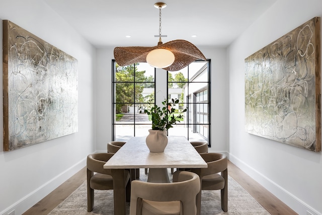 dining area featuring light wood-type flooring