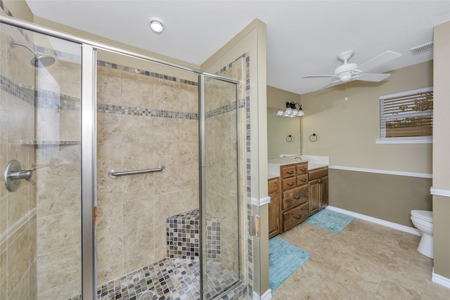 bathroom with ceiling fan, toilet, vanity, and walk in shower