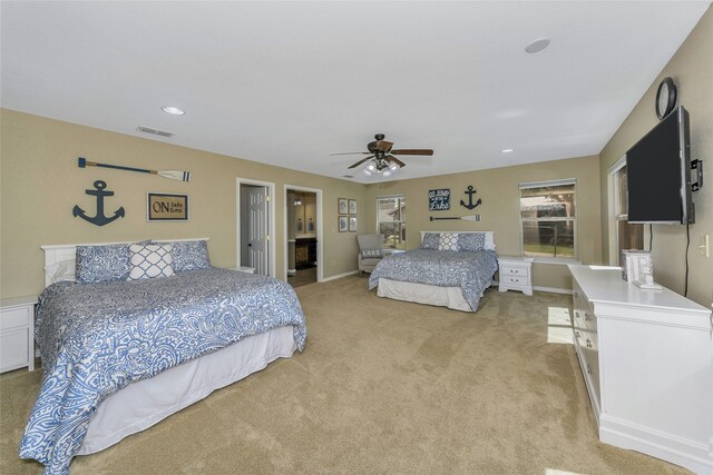 bedroom featuring ceiling fan and light carpet