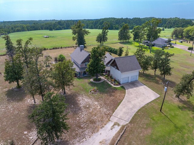 rear view of house featuring a lawn