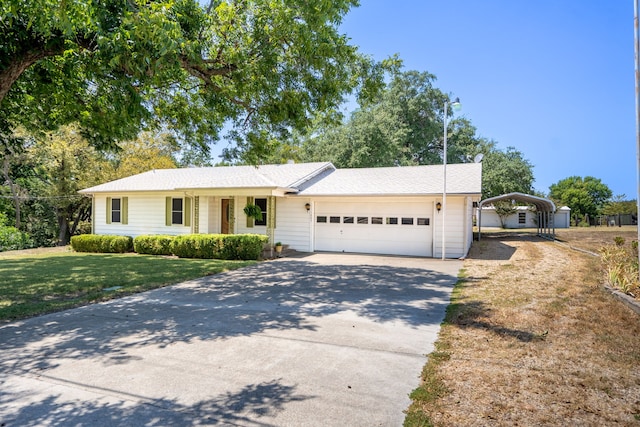 ranch-style home featuring a front yard and a garage