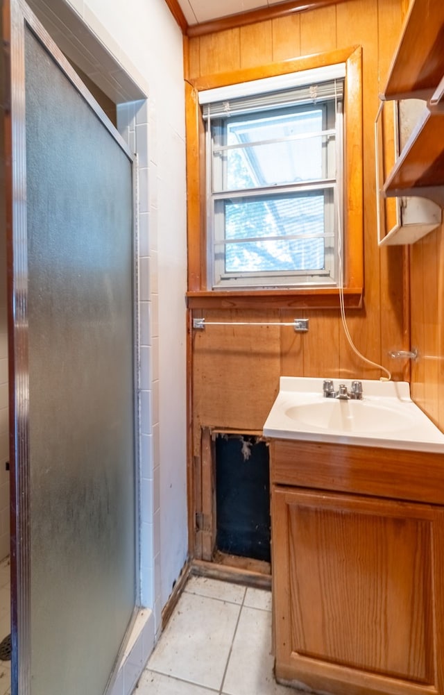 full bath with vanity, wooden walls, and a shower stall