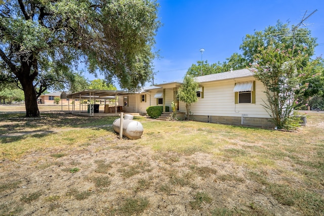 back of property featuring a pergola and a lawn