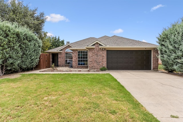 ranch-style home featuring a garage and a front yard