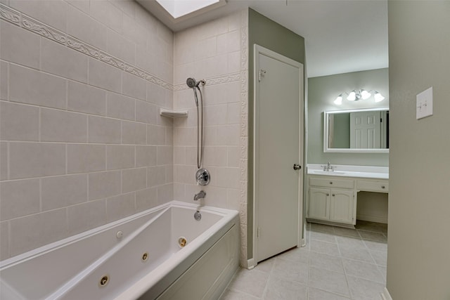 bathroom featuring tile patterned floors, vanity, and tiled shower / bath combo