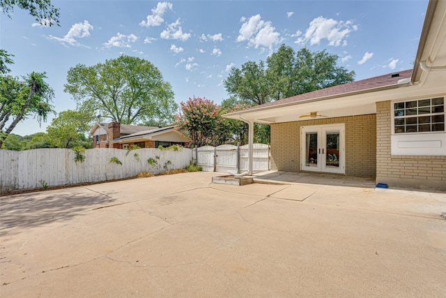 view of patio / terrace with ceiling fan and french doors