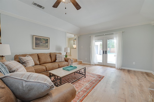 living room featuring ceiling fan, ornamental molding, light hardwood / wood-style flooring, and french doors