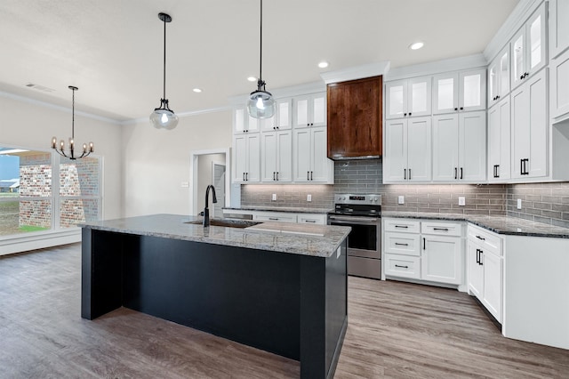 kitchen featuring light wood-type flooring, sink, stainless steel range with electric cooktop, and white cabinetry