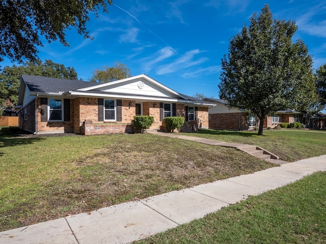 ranch-style home featuring a front yard