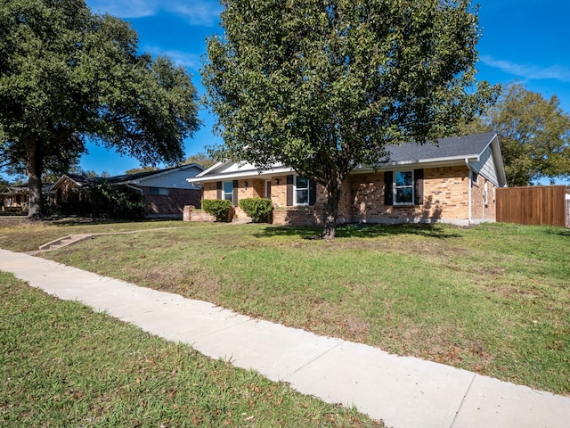 single story home with a front yard