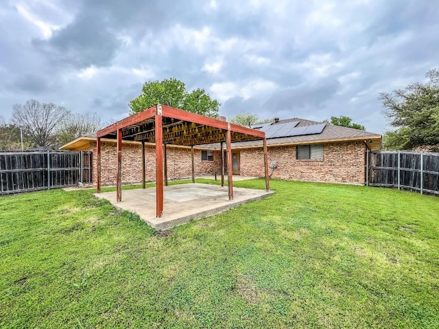 view of yard featuring a patio area and a fenced backyard