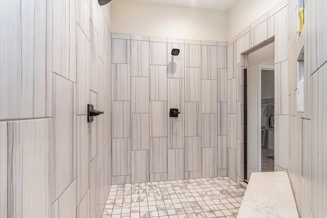 bathroom with tiled shower