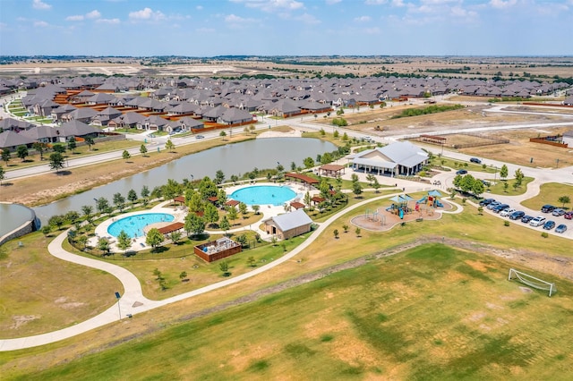 birds eye view of property with a water view